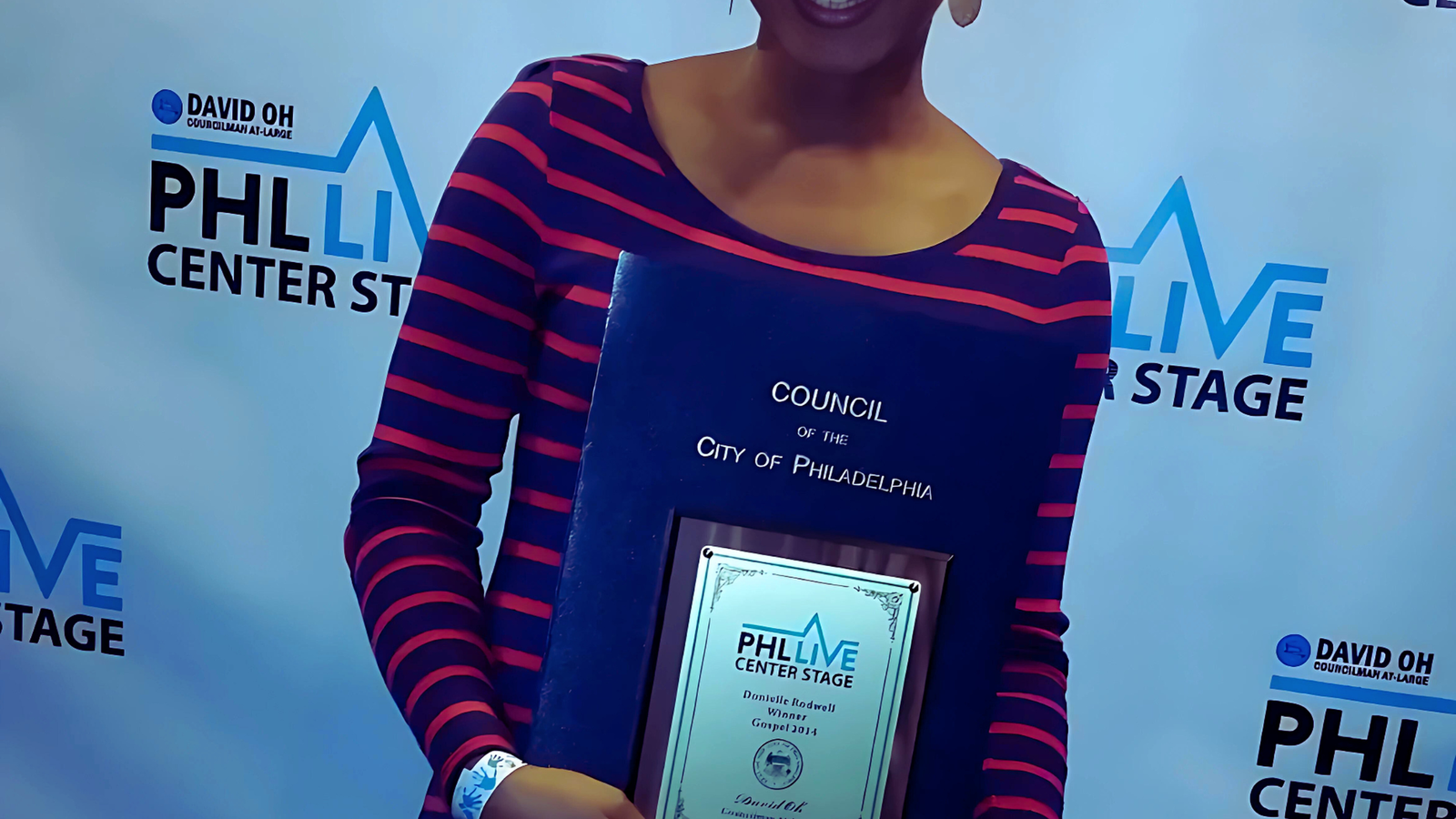 Donielle Rodwell at PHL Live Center Stage holding the award